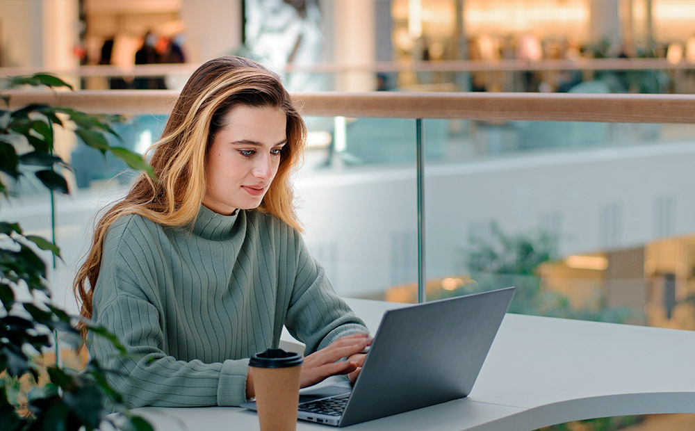 Young person studying for the bar exam in a library